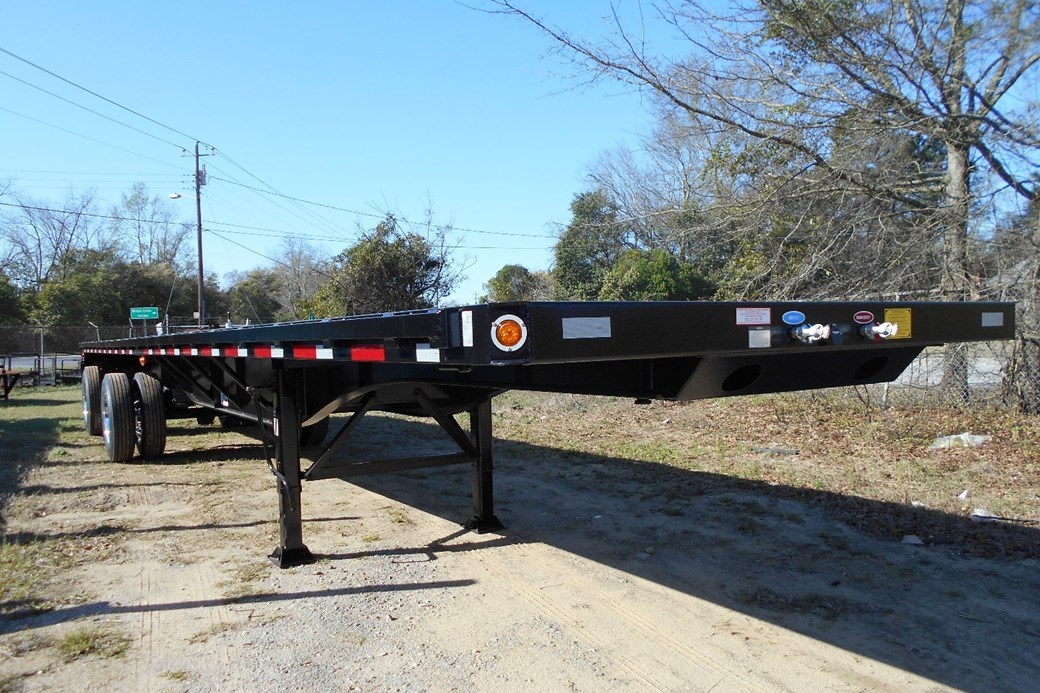 The 42' flatbed has retractable twistlocks in order to carry 40' ISO containers